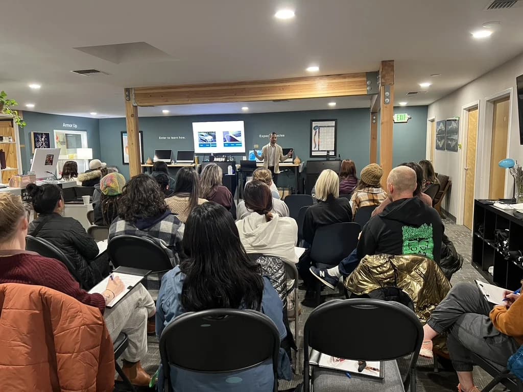 A packed workshop room watching the presenter