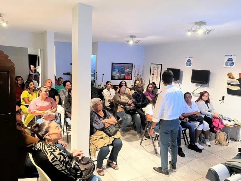 A member presenting to a room of attendees