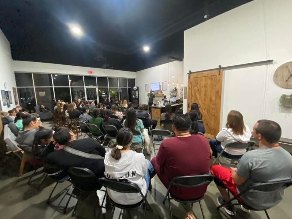 A large evening workshop, a room full of attendees