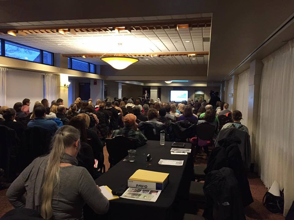 A large conference-room workshop, a full house